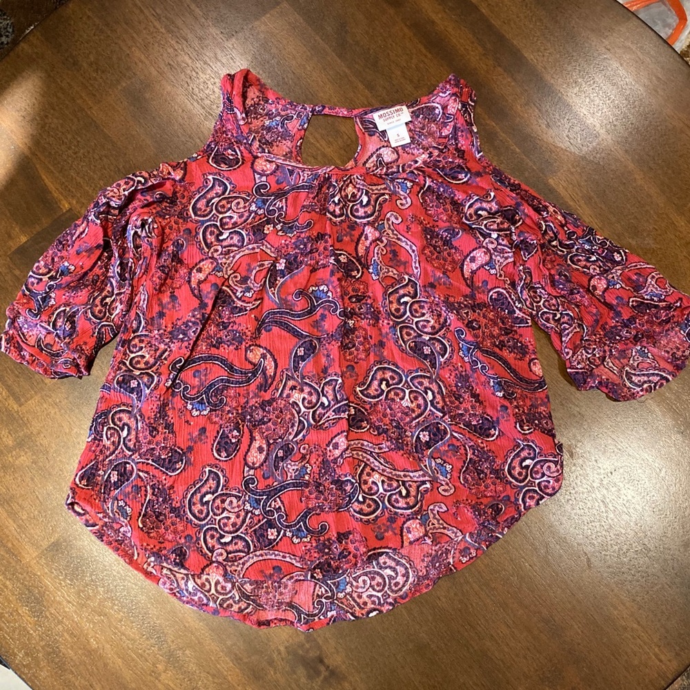 Pink patterned blouse with shoulder exposed